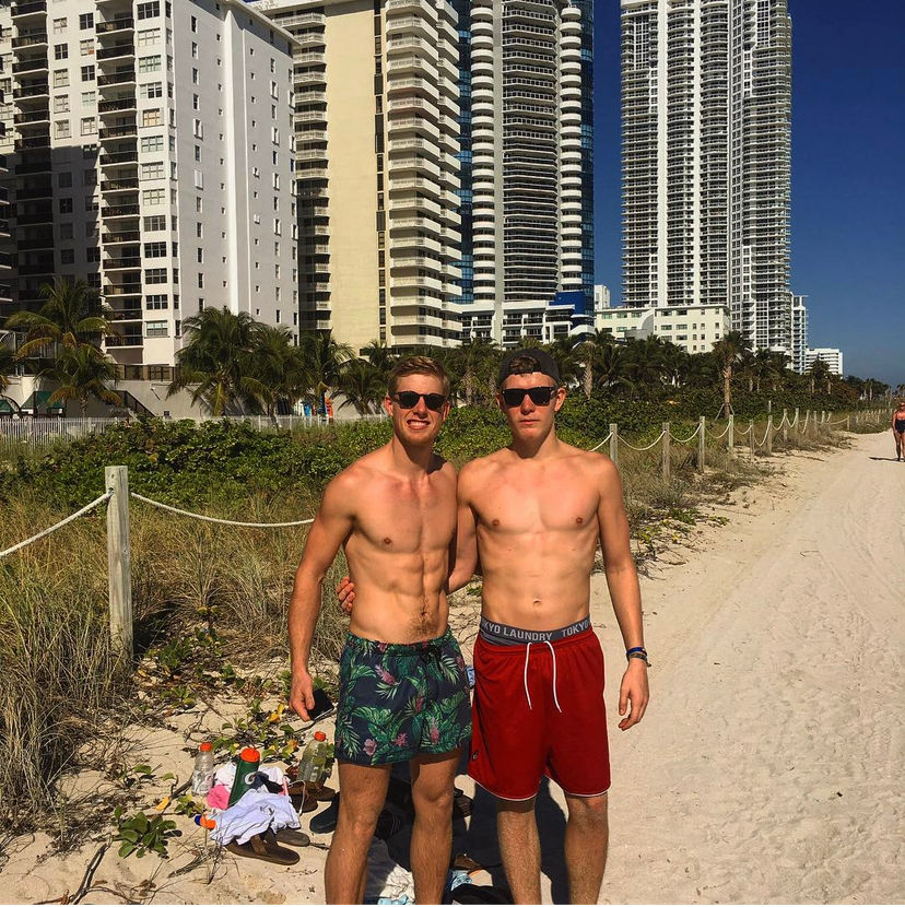 Quentin Geczy on the beach with a friend