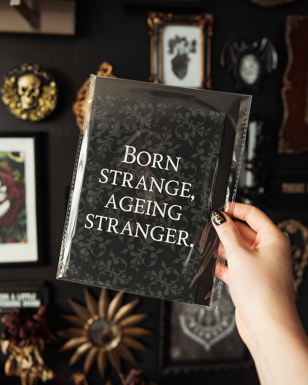 A5 gothic birthday card with dark damask background, and text saying ‘born strange, ageing stranger’