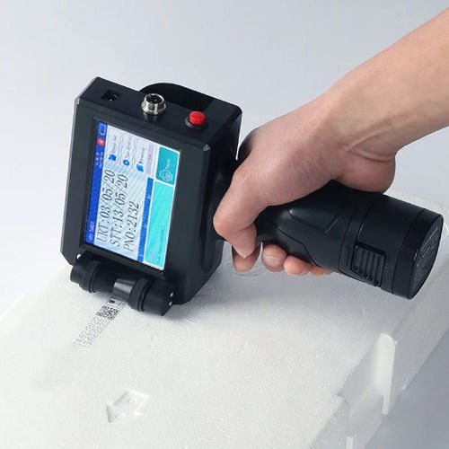 Eye-level view of a handheld inkjet coding machine in operation