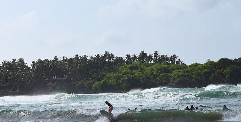 surfing in hiriketiya.jpeg