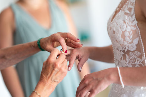 the bride puts on her grandmother's ring
