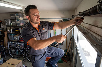 San Diego Garage Door Repair Technician Replacing Spring opener.jpg
