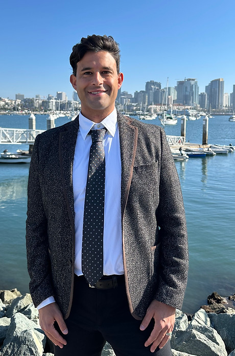 Tim Arnous with downtown San Diego and the bay in the background