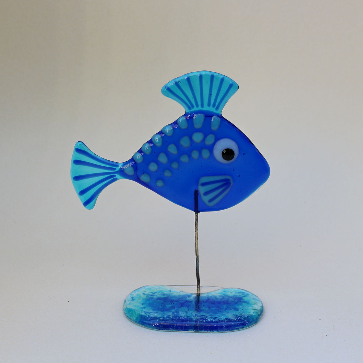 Fish on glass stand