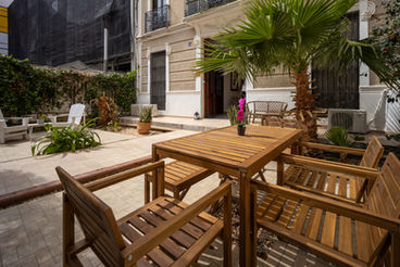 Front courtyard with dining table and space for bikes
