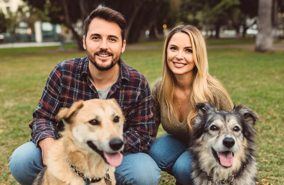 Couple with dogs in Park.png