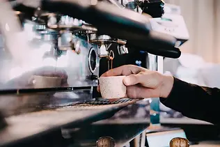 fresh-double-espresso-being-made-by-barista.webp