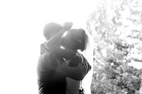 Bride-and-groom-kiss-in-sun