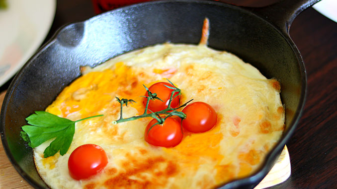Cherry Tomatoes Defying Gravity In An Iron Skillet