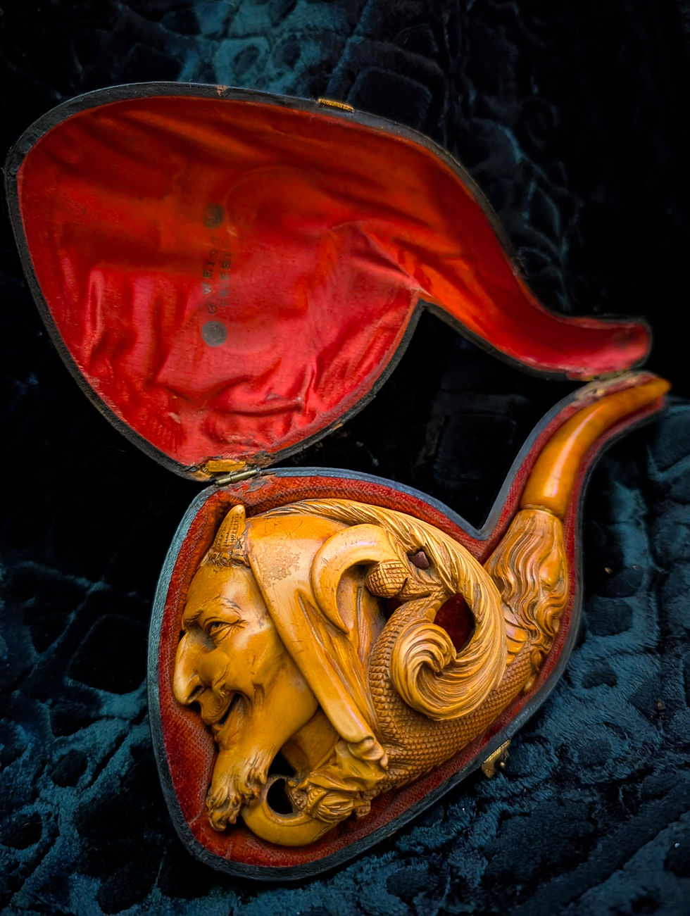 Giant deeply carved Victorian era Meerschaum pipe depicting Mephistophales or Satan in red satin case, marked "G. Weiss TRIESTE"