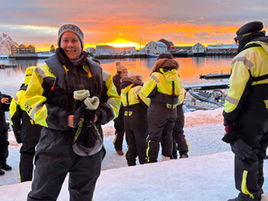 Passengers wearing flotation suits before a whale watching RIB trip in northern Norway.