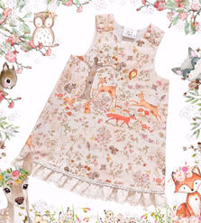 Handmade dress in a woodland animal print 100% woven cotton fabric in soft earthy colours
