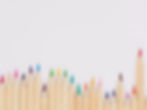 colored pencil lined up on top of white surface_edited.jpg