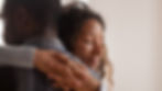 A couple hugging after a talk