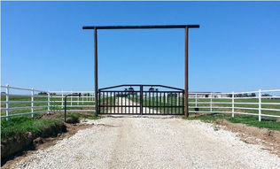 Black gate white fence.jpg