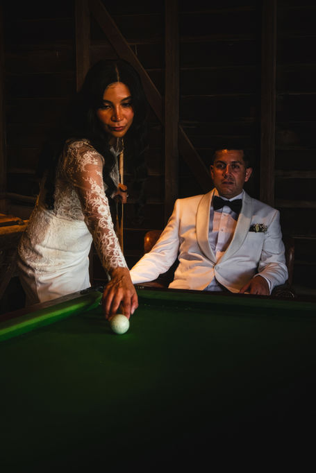 bride and groom playing pool at Spicers hidden vale