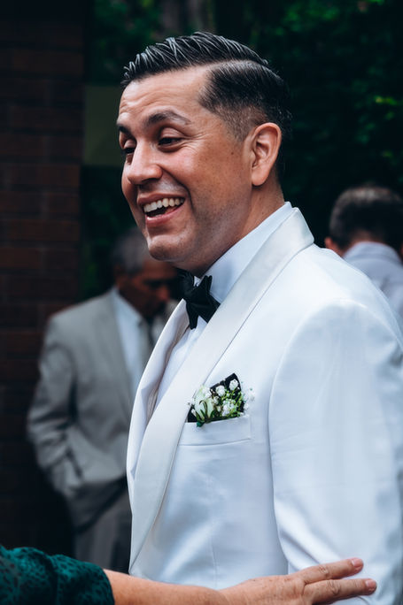 candid groom smiling