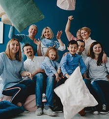 grandparents-parents-their-little-children-sit-together-bed-blue-room.jpg
