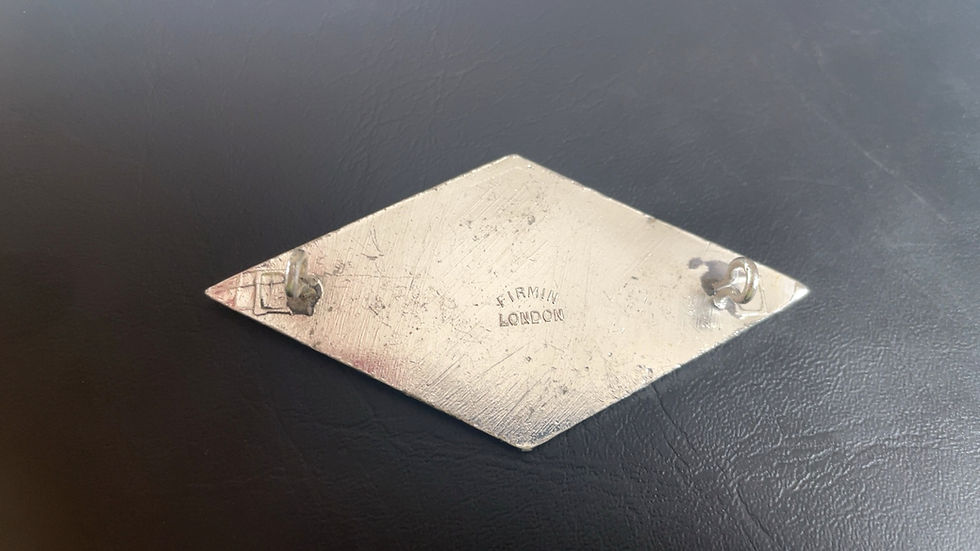 Thumbnail: back of a silver coloured badge