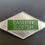 Thumbnail: silver and green bus drivers badge