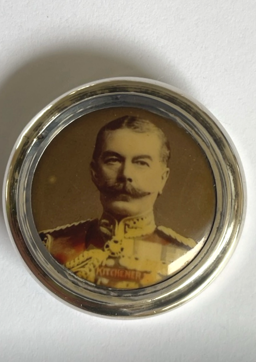 Lord Kitchener silver bottle top