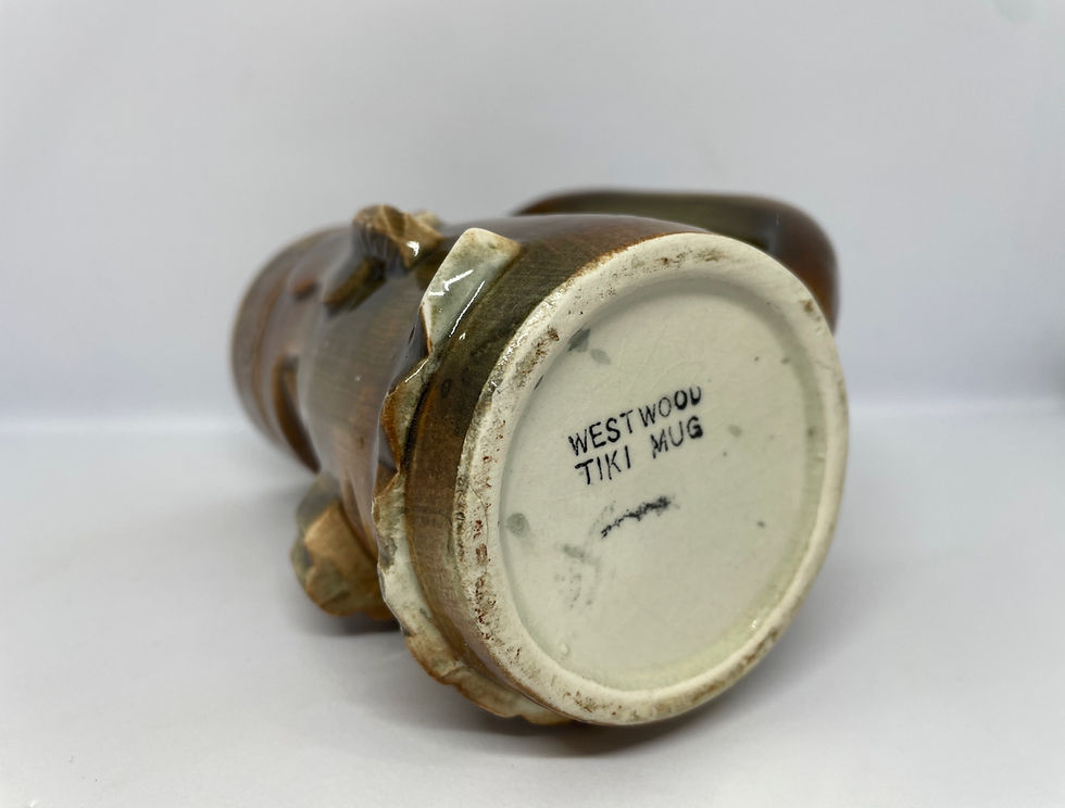 Thumbnail: Brown Tiki shaped mug base view