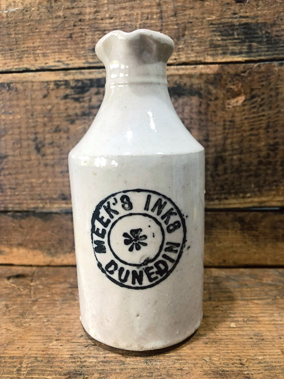 white stoneware ink bottle with label