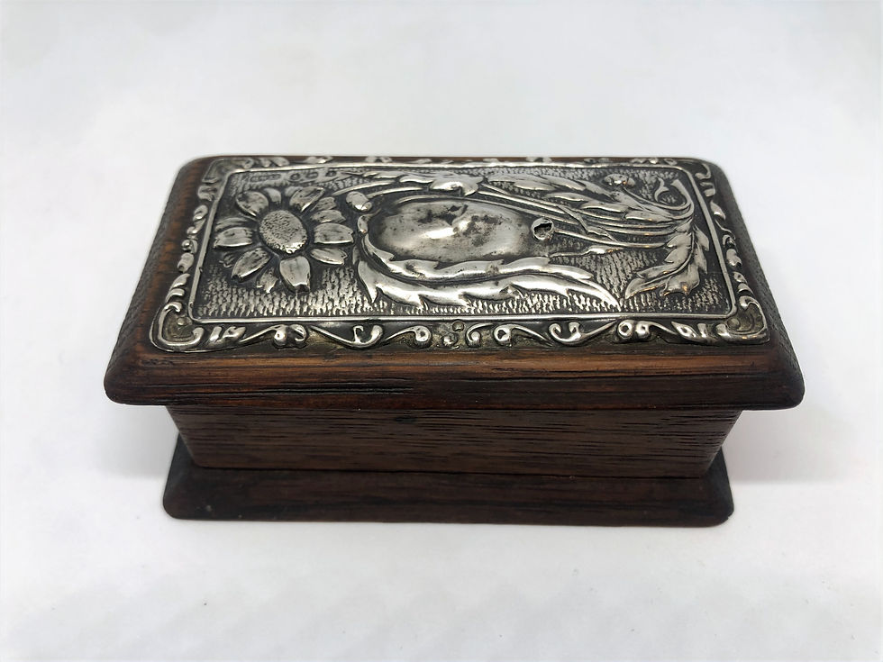 antique wooden box with silver lid