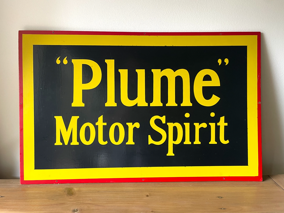 vintage yellow and black advertising sign