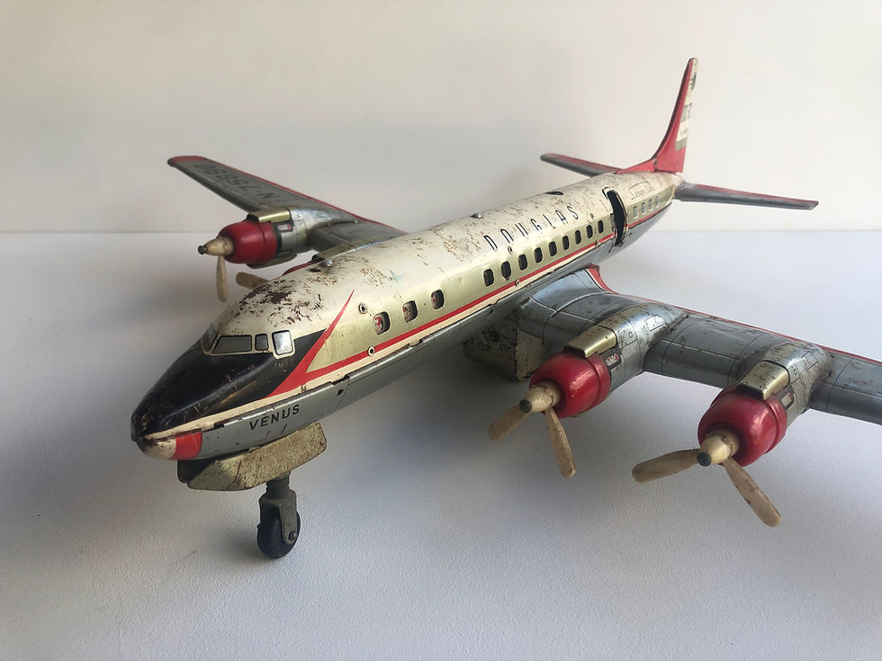 Thumbnail: vintage tin aeroplane toy