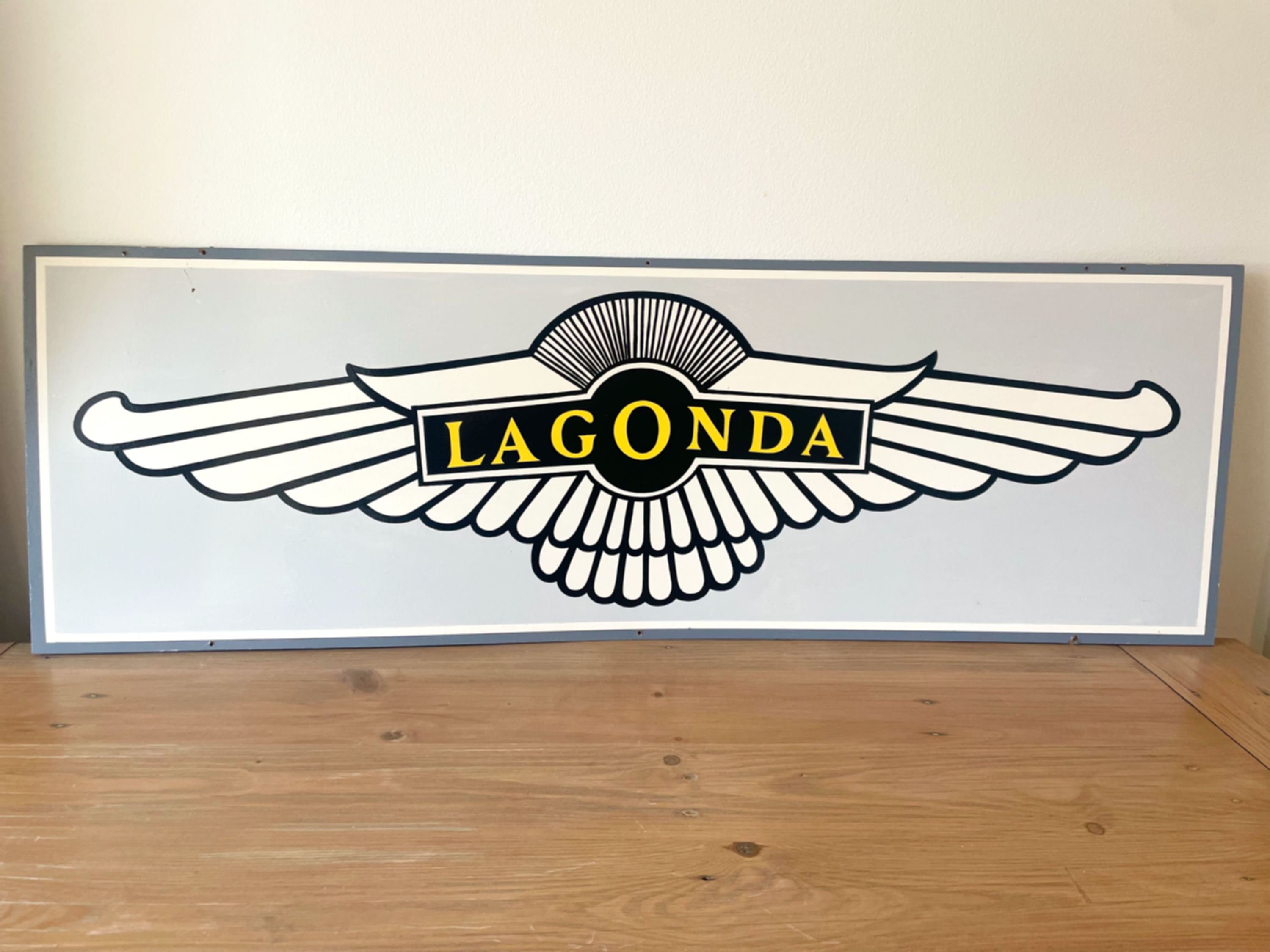 Lagonda motif advertising sign