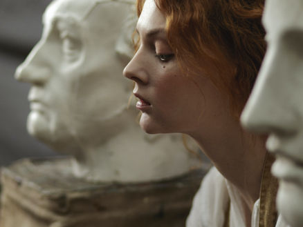 woman admiring sculptures