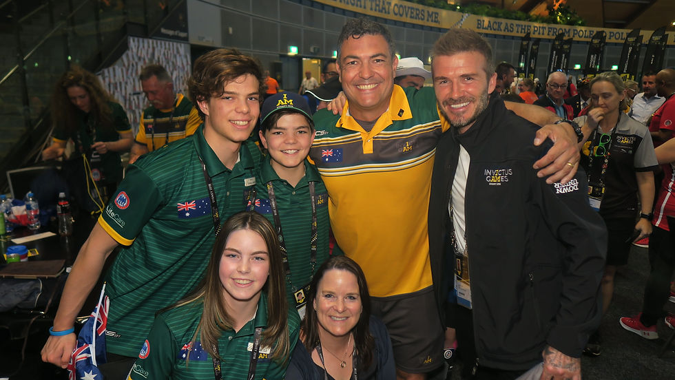 Ben Farinazzo with his wife and children celebrating with David Beckham at Invictus Games Sydney 2018.