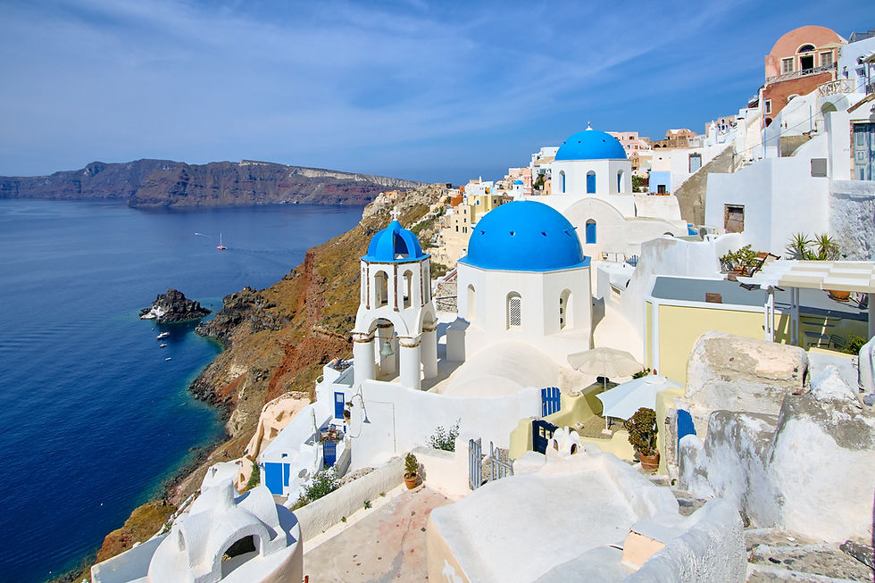 Famous White buildings next to the deep blue Aegean sea