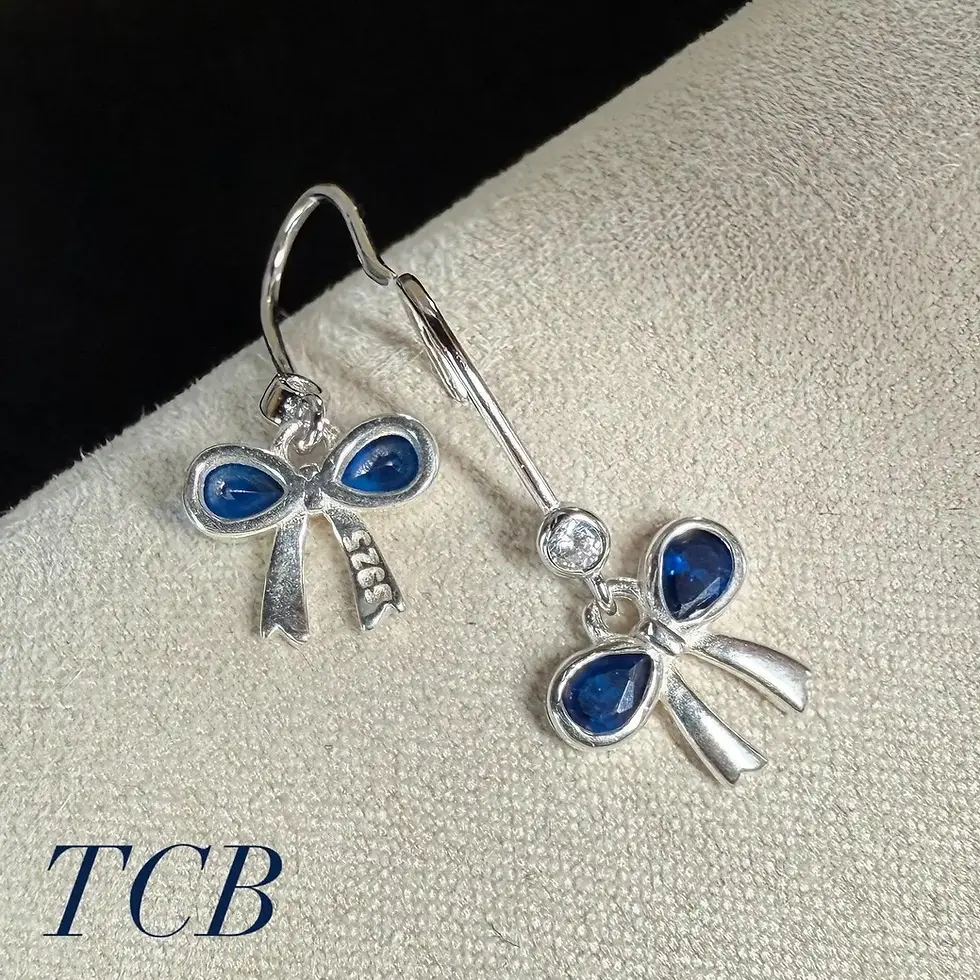 Thumbnail: Sparkling Royal Blue Bow Charm Earrings: Silver 925