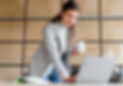 professional-young-smiling-businesswoman-holding-coffee-cup-white-working-laptop.jpg
