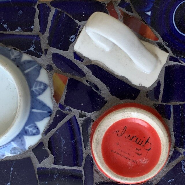 Mosaic with pieces of broken dishes