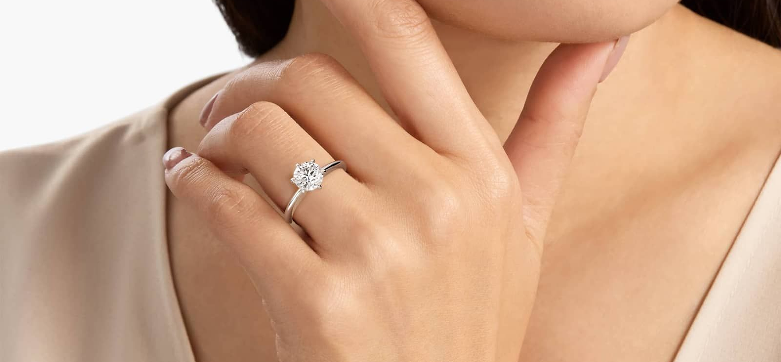 image of women modeling ring and a necklace