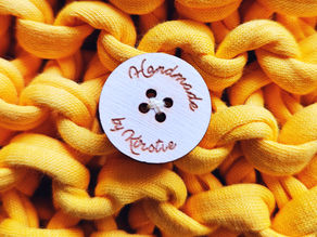 Handmade by Kirstie button on yellow crochet bag
