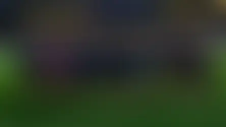 Seleção do Brasil posa para foto em estádio lotado, com uniformes azul-escuros e chuteiras rosa.