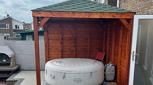Gazebo with two solid walls on deck.jpg