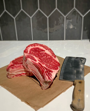 Ribeye steak with a butcher's knife