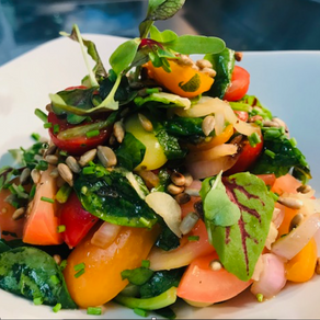 Heritage tomato salad with capers and toasted sunflower seeds 