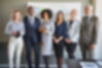 team of business people looking at camera
