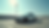 Eye-level view of a rental car parked in a lot with a clear sky