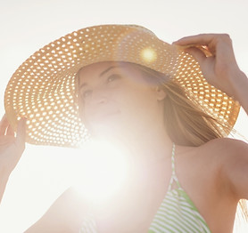 Young Woman in Sun Hat on Beach