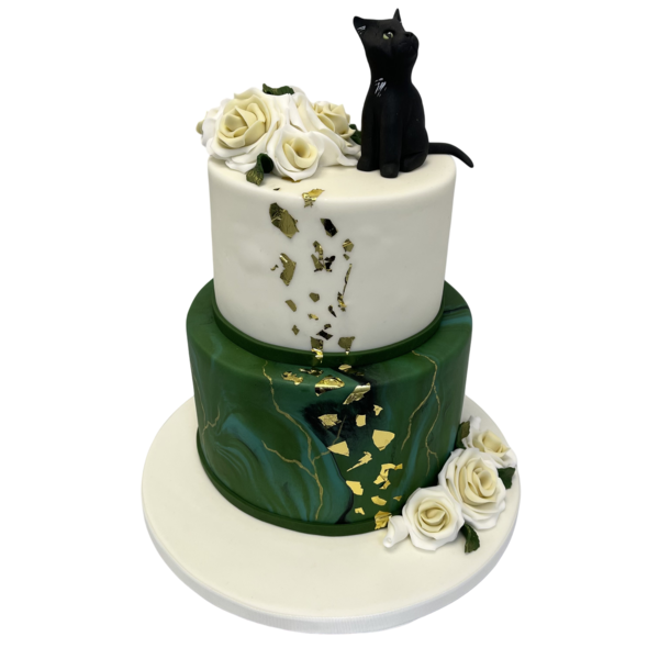 Two-tiered wedding cake with white roses, emerald green marble, and black cat.