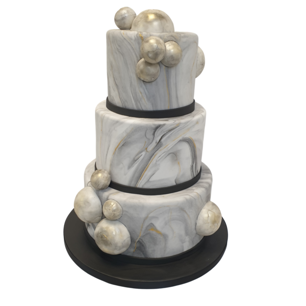 Three-tiered marble wedding cake with metallic spheres and elegant design.