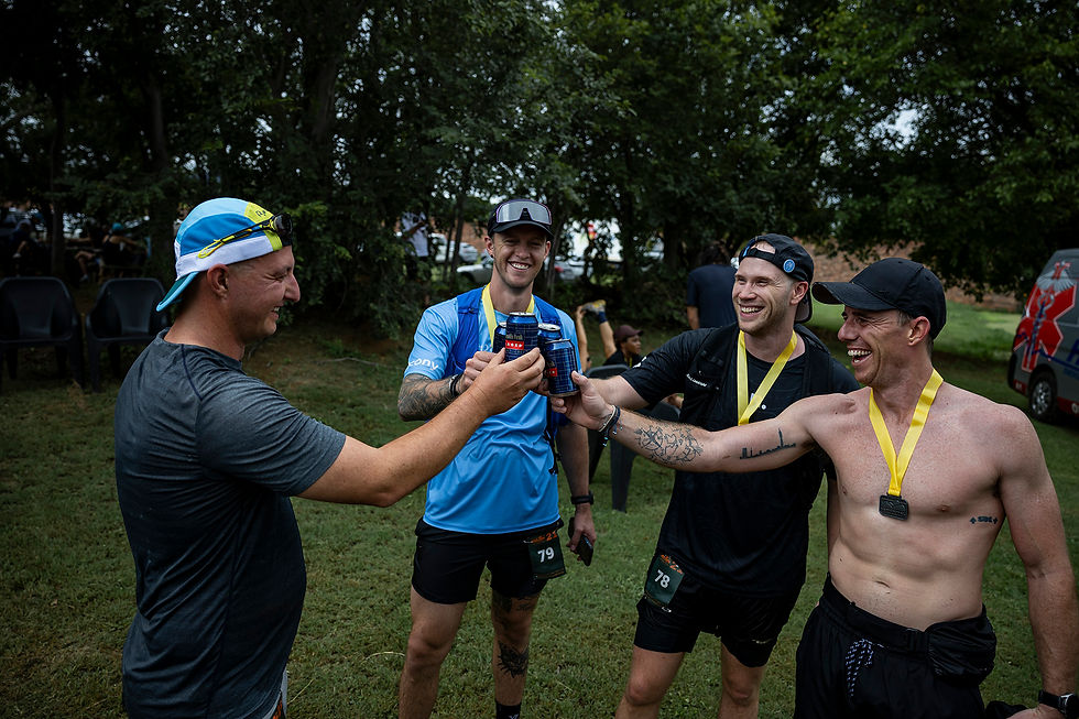 Trail running friends enjoy a beer after a lekker day on the trails