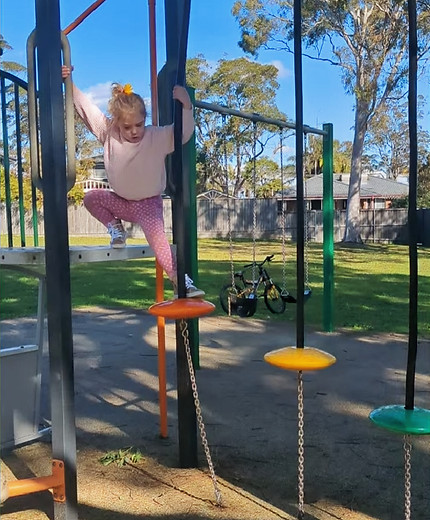 Maddie at the park - wobbly steps_edited.jpg